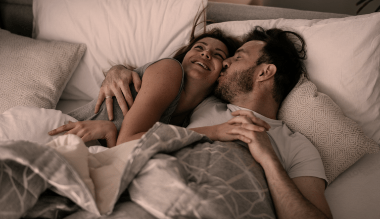 Boyfriend kisses his partner while sleeping